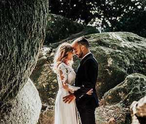 Bride and groom among giant boulders