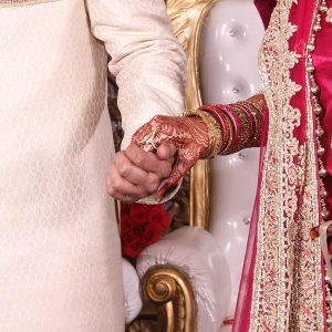Indian Wedding Groom and Bride Holding Hands